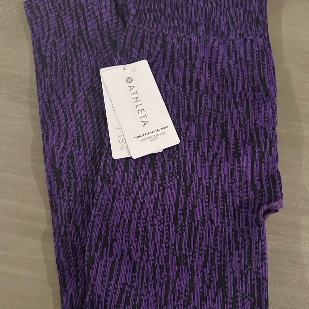 Black and purple NWT Athleta Flurry Elemental Tight